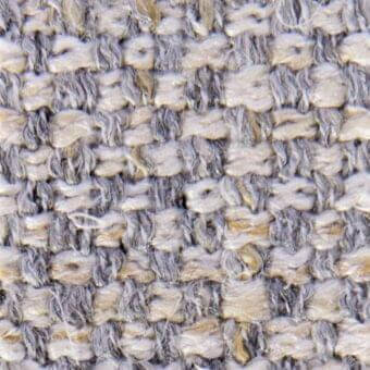 Woven fabric texture, gray and beige with gold threads, heathered appearance, nubby matte surface, possibly wool blend, Vezzelloni collection.