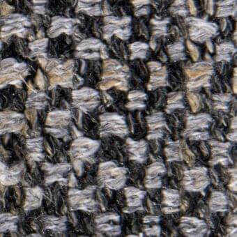 Tweed-like fabric texture, charcoal gray and beige heathered weave, irregular nubby yarns, durable upholstery material, Vezzelloni collection.