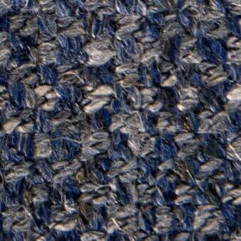 Navy blue and gray heathered fabric texture with a dense, nubby weave and irregular looped fibers suggesting a wool blend composition.
