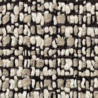 Woven fabric texture, off-white, dark brown, beige yarns, irregular geometric pattern, substantial nubby weave, verzelloni zambesi 17012 label.