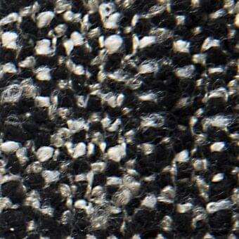 Dark gray fabric texture with interwoven silver threads, displaying a tightly woven, slightly raised, and subtly reflective surface.