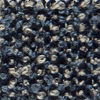 Navy blue woven fabric with silver metallic threads, exhibiting a looped, textured surface and subtle “verzelloni” product labeling.