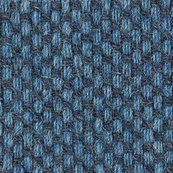 Woven fabric texture, blue and navy heathered tones, dense grid pattern with fuzzy yarns; Argali 18039, Vezzelloni collection fabric top.