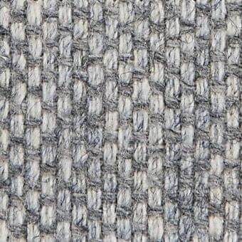 Woven fabric texture, off-white and gray heathered blend, basket weave pattern with nubby yarns, verzelloni argali 18042 label visible.