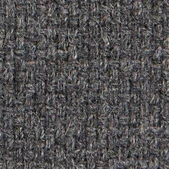 Dark charcoal gray woven fabric texture with heathered tones, exhibiting a tight bouclé weave and matte finish; argali 18043 textile sample.