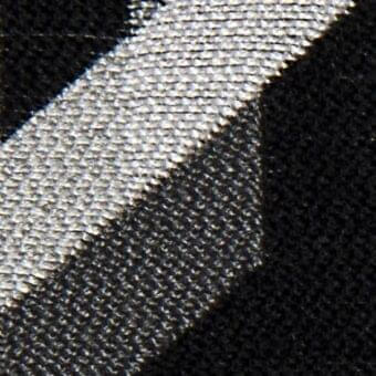 Woven fabric texture, light gray Atena 20024, diagonal band against dense black fibers, contrasting sheen and velvety pile.