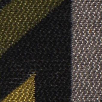 Diagonal plaid fabric texture in black and golden-yellow with a woven, rough surface; gray fabric section and text label visible.