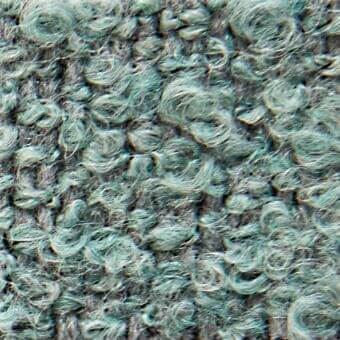 Teal and gray looped pile fabric texture with subtle sheen, displaying tight curls and fiber variations; verzelloni Calvin 22028 fabric sample.