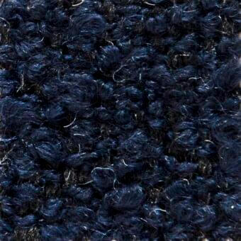 Navy blue looped fabric texture with nubby surface and scattered cream strands, displaying an irregular organic structure; verzelloni calvin 22029.