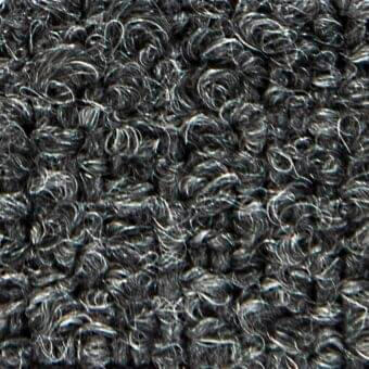 Dark gray looped pile fabric with crimped texture, tightly coiled fibers, and subtle tonal variations; sample displays “calvin 22031” text.