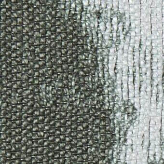 Woven fabric texture with dark to light gray gradient, displaying varying weave densities and integrated text “verzelloni deva 20011”.