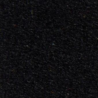 Black woven fabric texture with gold and red flecks, dense nubby pile, visible fibers, studio lighting, “divina3 28037” label.