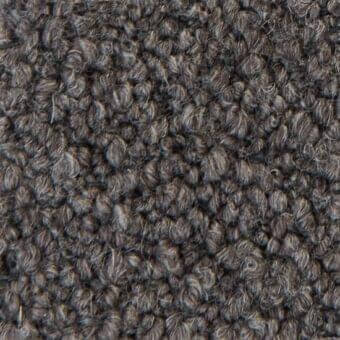 Gray verzelloni fabric texture with dense, rounded tufts displaying varied charcoal and silver tones and a three-dimensional surface.