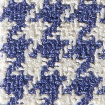 Houndstooth fabric texture in navy blue and off-white, densely woven with a nubby surface and irregular tweed-like construction, labeled Gwen 15057.