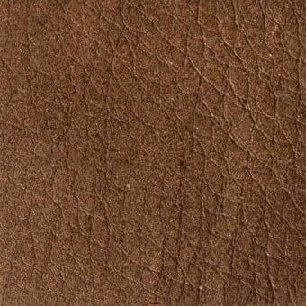 Brown leather texture with intricate grain, displaying irregular lines and creases, a matte finish, and subtle tonal variations.