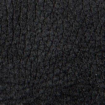 Dark gray leather texture with a heavily puckered, quilted surface featuring dense vertical ridges and a matte finish.