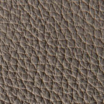 Gray quilted leather texture with a repeating diamond pattern and linear creases, exhibiting a matte finish and subtle tonal variations.
