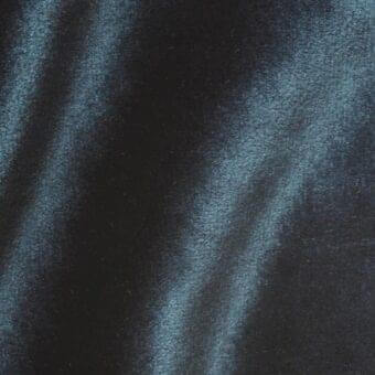 Charcoal velour fabric sample with turquoise light streaks, exhibiting a dense, brushed texture and directional sheen.
