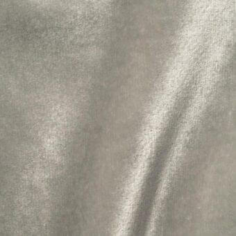 Vismara brilliant velour fabric swatch in cool gray, displaying a dense, plush texture with directional nap and soft folds.