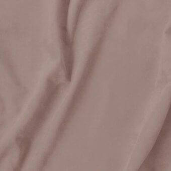 Velvet fabric swatch in dusty rose, matte finish, draped with soft folds showing texture and weight; label reads "vismara > eco nabuk (a) > en53."