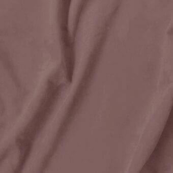 Fabric swatch in dusty rose, soft textured eco nabuk with a subtle sheen and visible folds, displaying “vismara > eco nabuk (a) > en319” label.