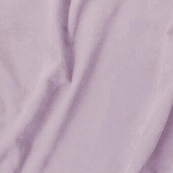 Lavender fabric swatch, smooth synthetic textile with subtle sheen, draped in soft folds and curves against a neutral background.