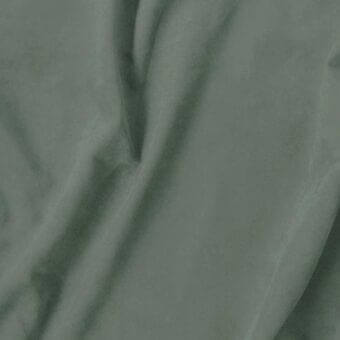 Olive-green textile sample with soft folds, lustrous surface, and subtle tonal variations; features product code “vismara > eco nabuk (a) > 37 en94”.
