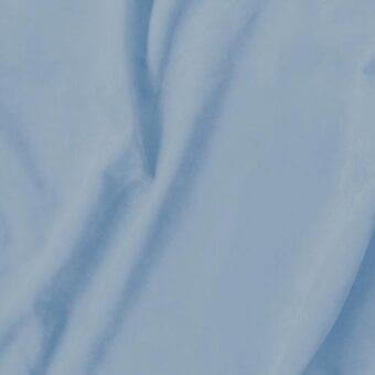 Light blue fabric swatch with a matte finish and smooth, napped texture, displaying soft folds and a consistent color throughout the composition.