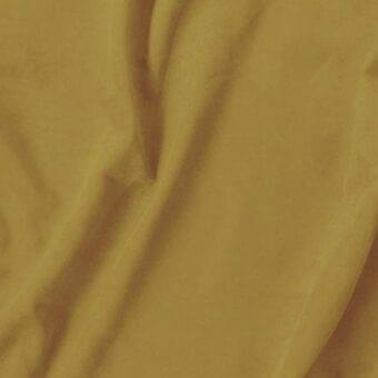 Mustard yellow Vismara Eco Nabuk textile with a subtle sheen, displaying soft, flowing folds and a smooth, pliable texture.