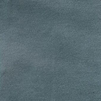 Matt velour fabric sample, cool blue-gray color, dense short pile texture with granular surface and uniform matte finish.