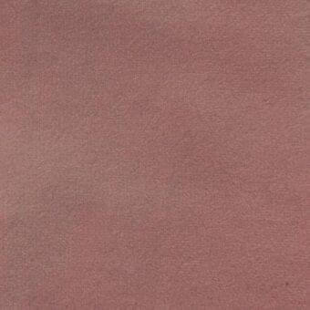 Matte velour fabric, dusty rose color, dense pile texture with granular surface, suitable for upholstery and soft furnishings.