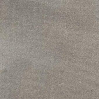 Matt velour fabric texture, muted gray color, uniform granular weave with imprinted brand name “vismara” at lower right.