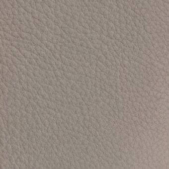 Nubuck leather texture sample, gray-brown tone, with dense irregular indentations and a matte, pliable finish identified as vismara na06.