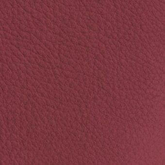 Reddish-brown pebbled texture with irregular grain, muted burgundy tone, matte finish, and organic appearance against a neutral backdrop.
