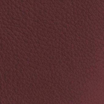 Reddish-brown nubuck leather texture sample with a dense, pebbled surface and muted burgundy tone, labeled “vismara na34”.