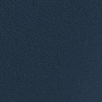 Dark blue fabric texture with a pebbled surface, exhibiting a fine grain pattern and matte finish; vismara nabuk (extra) na18 material.