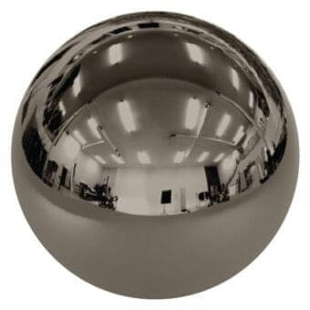 Spherical mirror, polished black nickel, reflects white room with fluorescent lights, whiteboard, and studio equipment in distorted fisheye view.