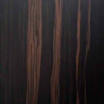 Ebony Makassar veneer wood texture displaying vertical grain, rich brown and reddish-brown hues, with a glossy polished sheen.